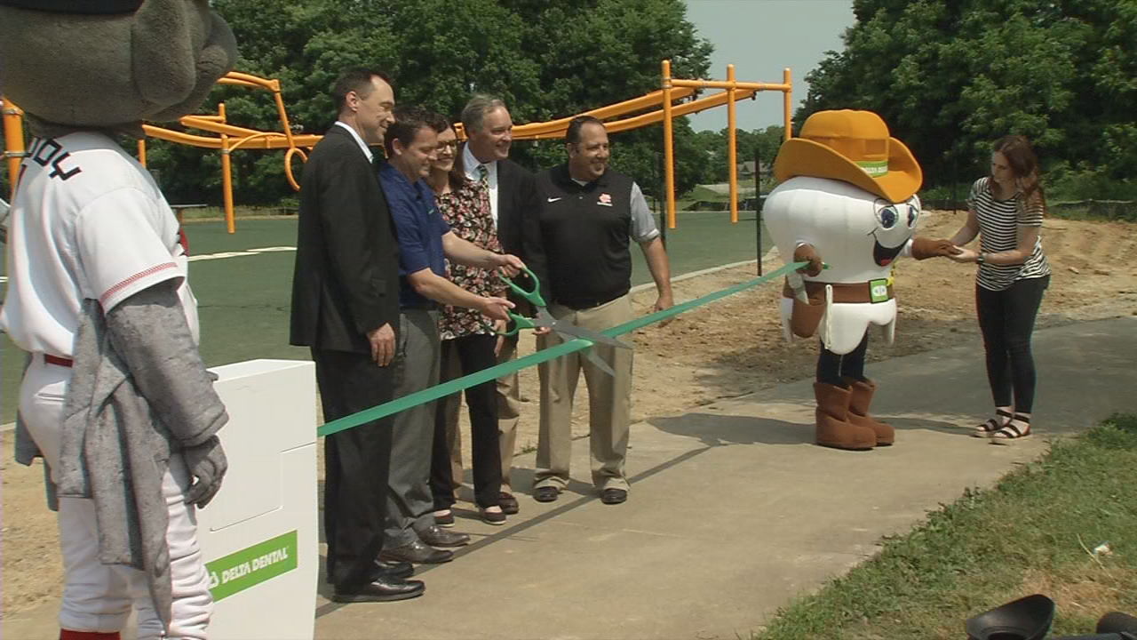 Ribbon cutting for new playground for kids with disabilities at Fern Creek Park